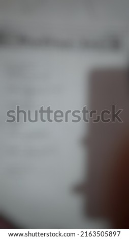 Defocused or blurred abstract background of a shadow reflected on the white wall