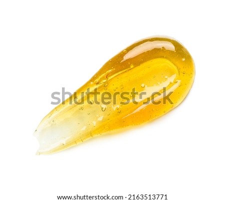 Golden honey or gel serum smear with bubbles isolated on white background top view Royalty-Free Stock Photo #2163513771