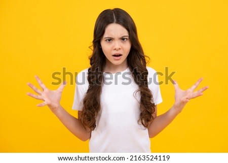 Angry teenager girl, upset and unhappy negative emotion. Studio portrait of sadness anger teen. Portrait of a very mad and upset child. Royalty-Free Stock Photo #2163524119