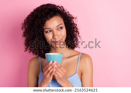 Photo of adorable peaceful minded lady enjoy fresh coffee look empty space isolated on pink color background