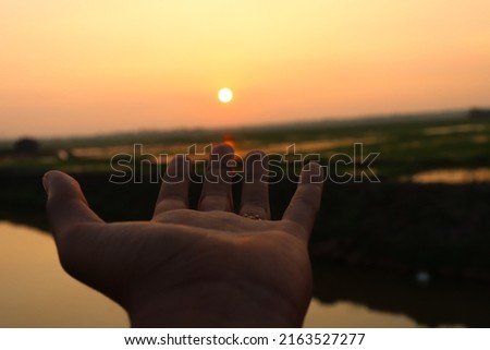 Picture of Sunset. Placed my hand to make the pic more engaging