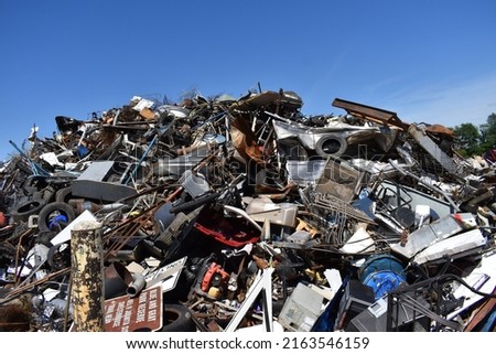 Pile of scrap metal in a salvage yard Royalty-Free Stock Photo #2163546159