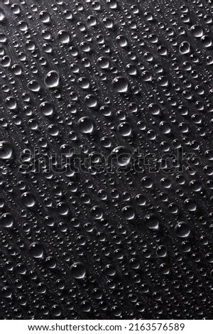 Abstract background with drops of water on iron surface. Raindrops on gray flat texture of steel