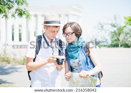 young travelers looking photo