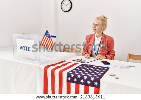 Beautiful caucasian woman working at political campaign smiling looking to the side and staring away thinking. 