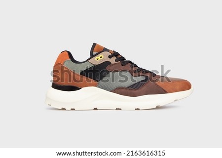 Fashionable design men's leather shoe sneaker for male isolated on white background. Sports skate casual shoe. Front view. Mock up, template