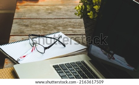 Leaves nature and computer keyboard with glasses.Technology with nature green concept