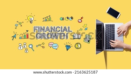 Financial growth with person working with a laptop