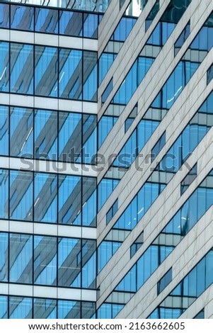 Glass facade of a modern building. Construction and rental housing.