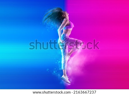 Woman jumping on neon background. Fitness model in jeans on neon background. Dance banner