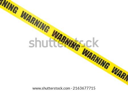 Yellow warning tape isolated and cutout on white background. Risk and accident concept Royalty-Free Stock Photo #2163677715