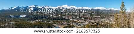 Panorama of Breckenridge, Colorado with ski trails on surrounding Rocky Mountains Royalty-Free Stock Photo #2163679325