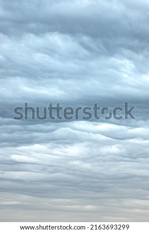 Heavenly pattern. Gentle colors of the cloudy sky. Cold and warm. Picture of beautiful nature. Calm mood. Changeable weather. Interior art.