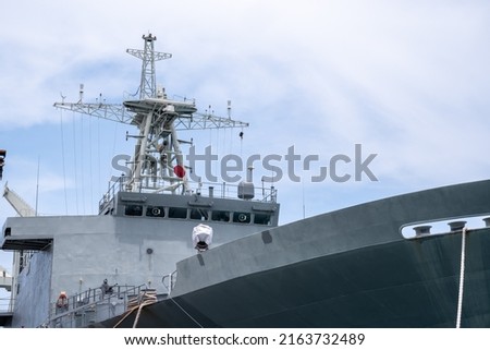 A large warship, parked for tourists to visit, behind the sky Royalty-Free Stock Photo #2163732489