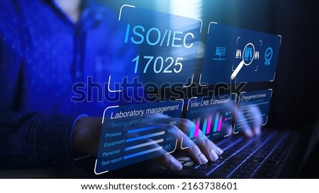 Auditor from product and service quality certification body is checking the laboratory system under the scope of the ISO IEC 17025 standard, which is a standard for testing and calibration management. Royalty-Free Stock Photo #2163738601