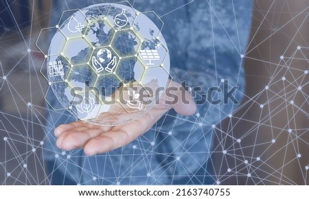 A hand holding a globe. Green planet concept. Understanding the need not to pollute the environment.	