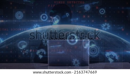 Image of cyber attack warning and scopes scanning over hacker using laptop. global internet security, data processing and cyber crime concept digitally generated image.