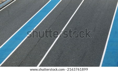 Asphalt race track pattern texture background. Royalty-Free Stock Photo #2163761899