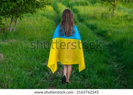Child with Ukrainian flag. Selective focus. Kid.