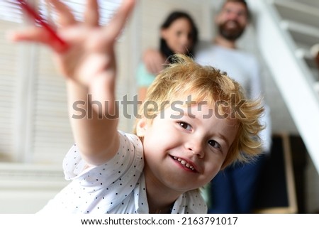 Children day. Happy family mother, father and child. Happy family with children on weekend. Young parents and their child are very happy at home. Funny kids face. Royalty-Free Stock Photo #2163791017