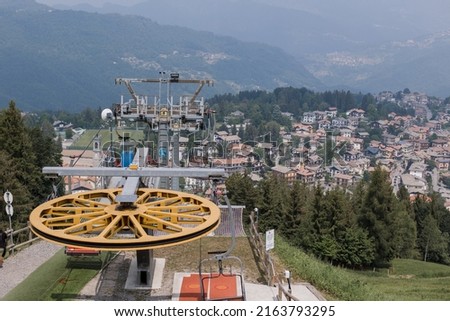 ski lift to a small town in the alps mountains of italy