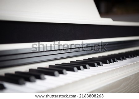 Modern electronic synthesizer piano. Professional pianist instrument. Curated collection of royalty free music images and photos for poster design template
