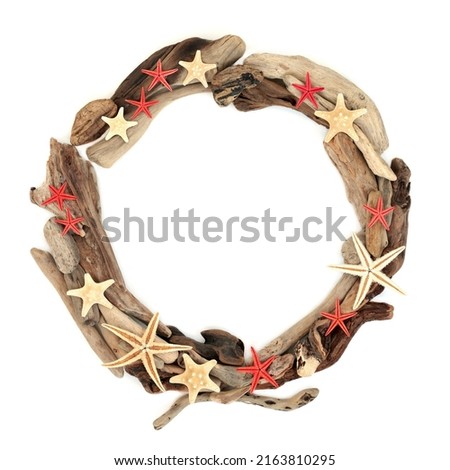 Driftwood and starfish sea shell wreath on white background. Natural abstract seaside summer sculpture nature composition. Top view, flat lay, copy space.