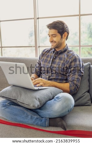 Creative agency freelance caucasian male working with laptop at coworking area office space.Young beard man using notebook remote studying, virtual training, watching online education webinar at home.