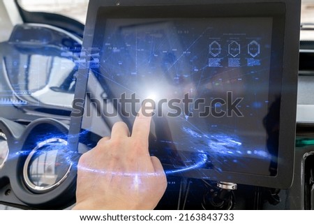 autonomous vehicle interior with hand touching screen and auto navigation system, futuristic style.