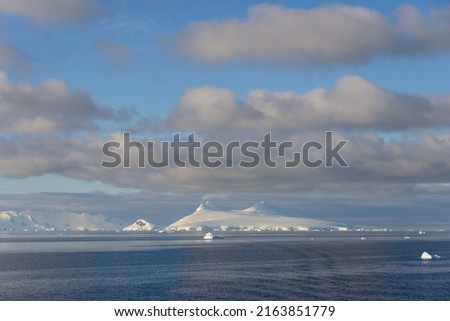 Beautiful Antarctiс seascape. Icebergs. Beautiful sky.