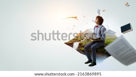 World of books concept with a student Royalty-Free Stock Photo #2163869895