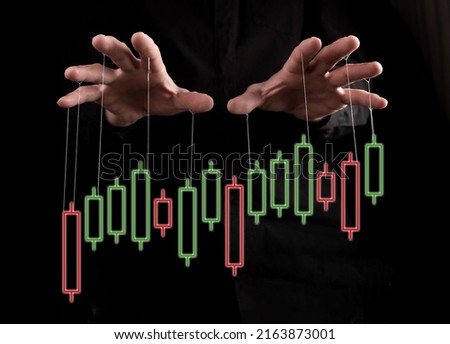 Stock market manipulation. Hands with strings over candlestick graph for changing, controlling price movement on black background. Frauds in trade and finance. High quality photo