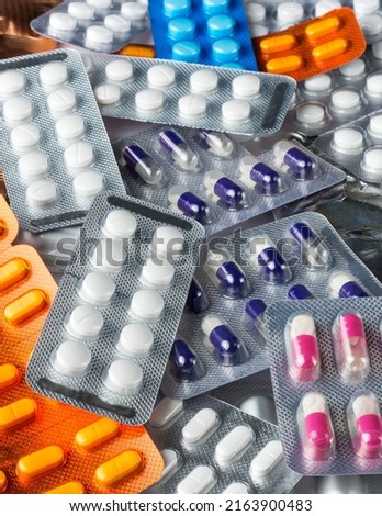 different types of medicine blister packs, medical drugs capsules and tablets with variety of colors, packages for pills, taken in shallow depth of field Royalty-Free Stock Photo #2163900483