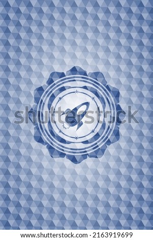 rocket icon inside blue emblem or badge with geometric pattern background. 