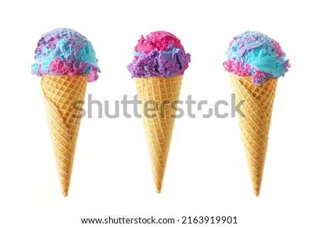 Three cotton candy flavored ice cream cones isolated on a white background. Pink, blue and purple color.
