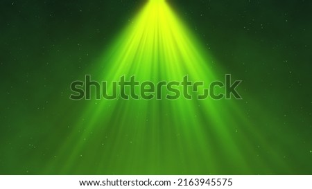 Spotlight background. Festive abstract spot light. Bright rays.  Glowing particles. Green color.