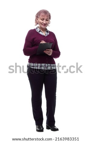 smiling adult woman signing a document. isolated on a white