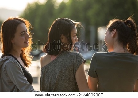 Young sports ladies on the side of the city road - stock photo Royalty-Free Stock Photo #2164009907