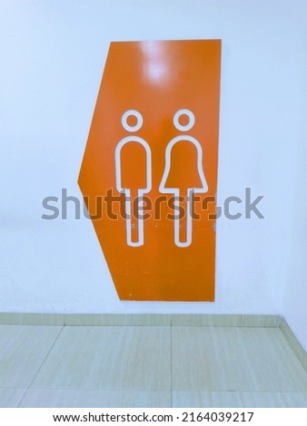Tangerang- Indonesia - June 5, 2022 - in this photo taken before entering the toilet and the picture shows the difference in the room between men and women