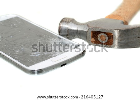 Hammer and cell phone with broken screen isolated on white