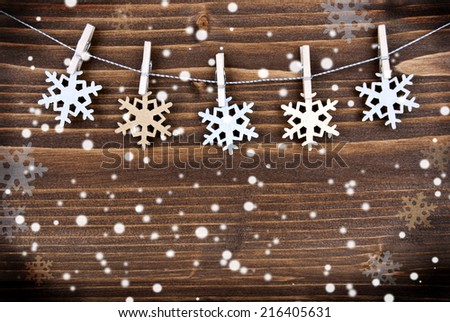 Snowflake Background with Golden and Silver Snowflakes on a Line on Wood with Snow, Winter or Christmas Background with Copy Space