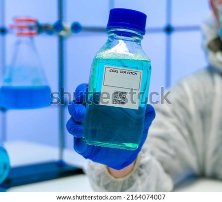 Coal Tar Pitch. Coal Tar Pitch hazardous chemical in laboratory packaging Royalty-Free Stock Photo #2164074007