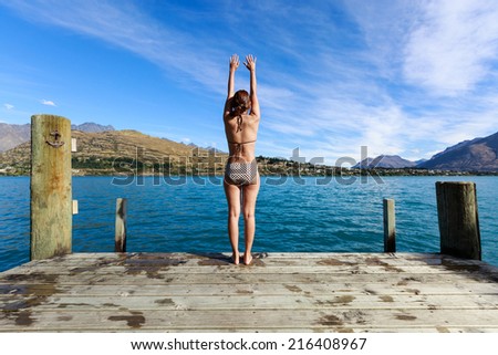young adult woman enjoy summer at Lake Wakatipu, Queenstown, New Zealand