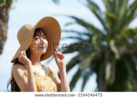 Young Asian women enjoying the resort Royalty-Free Stock Photo #2164146473