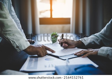 Business team collaboration discussing working analyzing with financial data and marketing growth report graph in team, Discussion and analysis data the charts and graphs. Royalty-Free Stock Photo #2164152761
