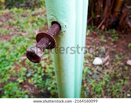 Rusted Bolt and plate used for clamping standing piles