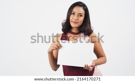 Empty blank paper in an Asian woman's hand.A studio portrait with white background.Empty Space for text 
