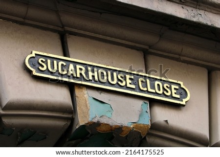 Old Traditional Street Name Sign for Sugarhouse Close on the Royal Mile in the Old Town Area of Edinburgh Scotland Royalty-Free Stock Photo #2164175525
