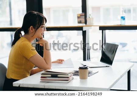 Skilled female software developer working on freelance use code libraries to simplify the transcription cooperating with advanced programmers adapt application to systems platforms via laptop Royalty-Free Stock Photo #2164198249