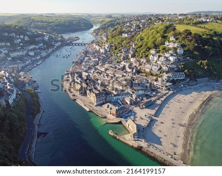 Aerial drone shot of Looe, picturesque seaside village in Cornwall, South west England, United Kingdom. Royalty-Free Stock Photo #2164199157